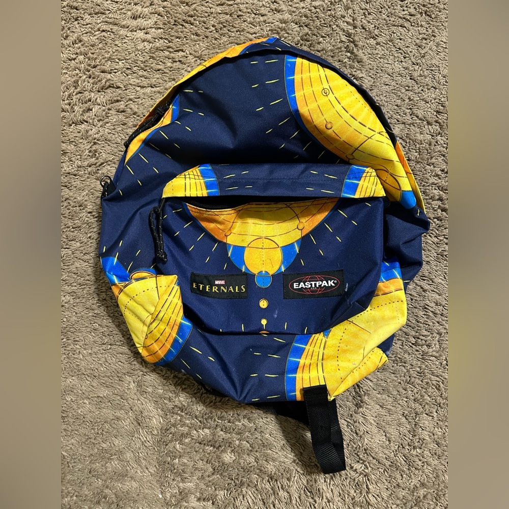 Vintage Eastpak Marvels Eternals “Blue & Yellow” backpack 00s
